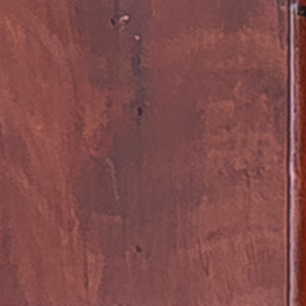 Close-up of Jarrah wood grain, deep red-brown